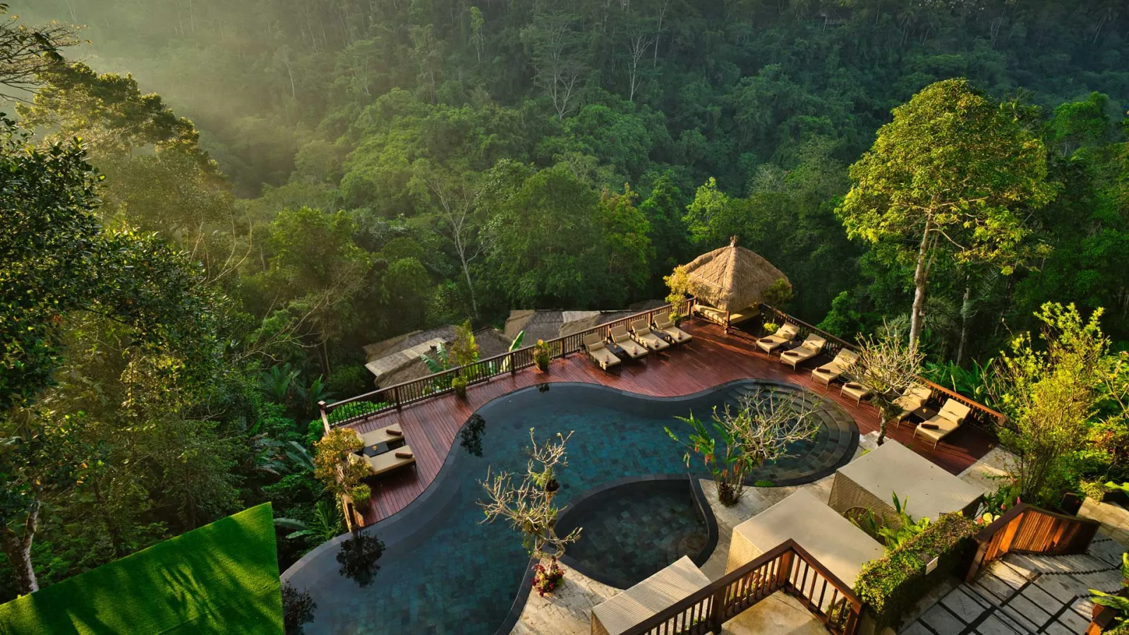 Jungle swimming pool and luxury villas at Nandini Jungle by Hanging Gardens in Ubud Bali.